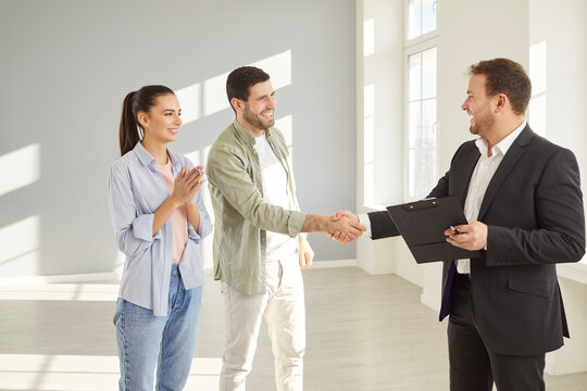 Realtor shaking hands with client